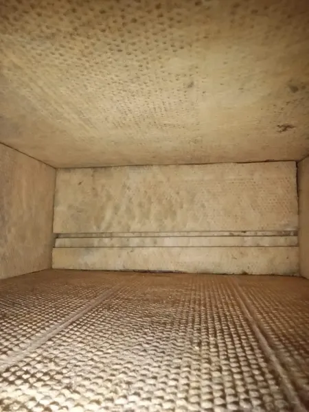 A fiberglass duct-board trunk completely clean after Armstrong's air duct cleaning.