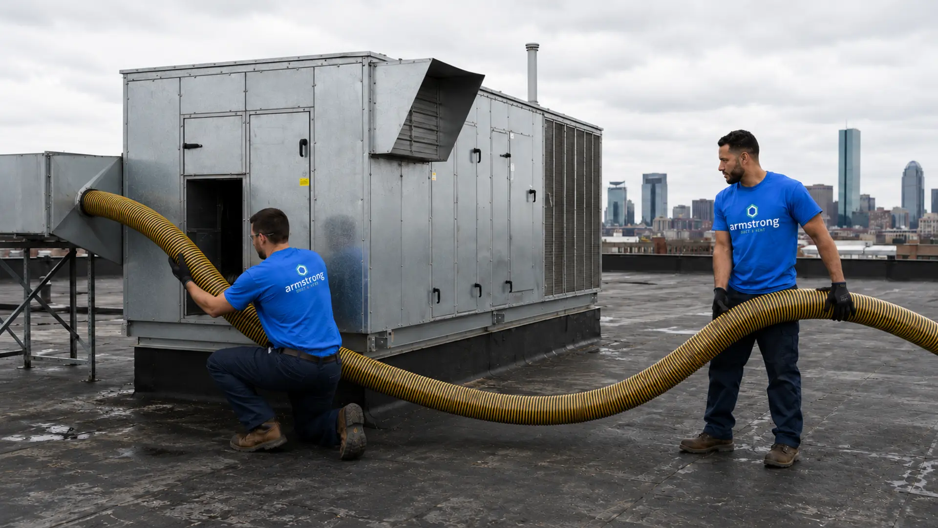 Armstrong crew servicing commercial rooftop HVAC and duct systems in New England